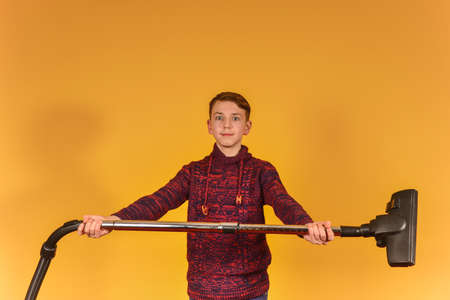 The guy with the vacuum cleaner on a yellow background
