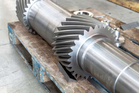 New shaft gear on a rack after production