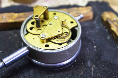 Disassembled dial gauge in the workshop under repair