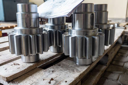 Shaft gear after manufacturing on a rack.
