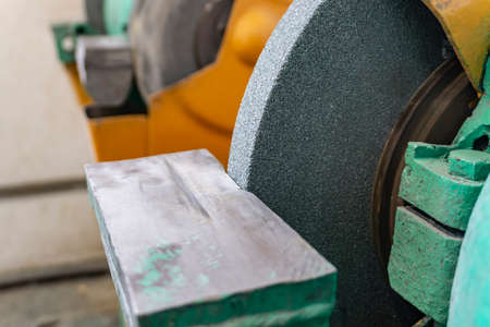 Industrial grinding machine for sharpening tools in the workshop at the enterpriseの写真素材