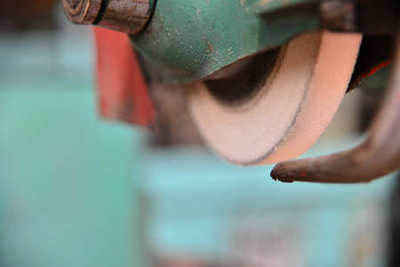 Grinding wheel on the machine close up with blur.