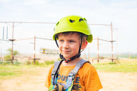 A boy in a yellow helmet in an extreme parkの写真素材