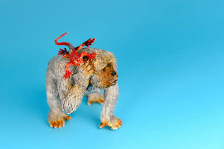 Toy animals made of plastic on a blue background, baby little animals.