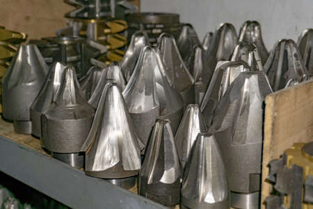 Gear cutting tool in a warehouse in a workshop, a worm cutter for gear processing on a gear cutting...