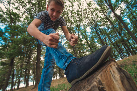 A guy lacing shoes, wide-angle photo, bottom view.の写真素材