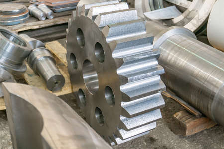 Gears on the rack after manufacturing at the manufacturing plant. Gear cutting in mechanical...