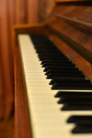 Piano with lights in backgroundの写真素材