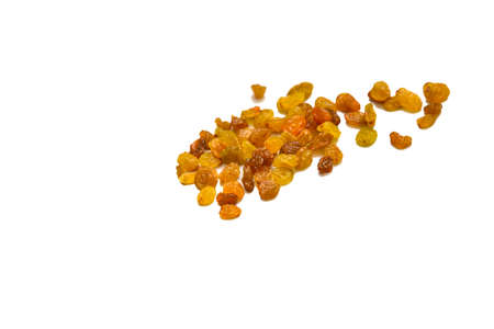Dried grape raisins lies on an isolated background.