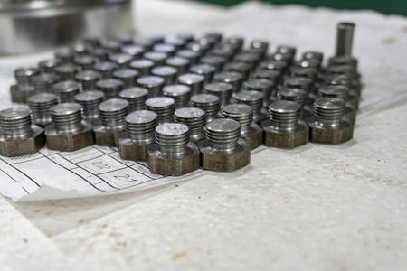 Small bolts with small threads, after turning, are on the technical drawing