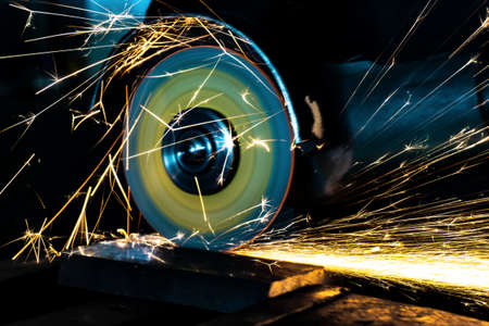 Cutting abrasive wheel on a grinder in work, closeupの写真素材