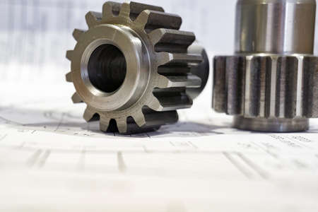 The gear after manufacturing on the gear cutter lies on the technical drawing