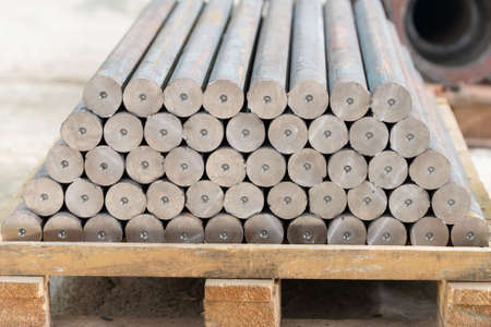 The shaft after turning on the rack in the workshop.