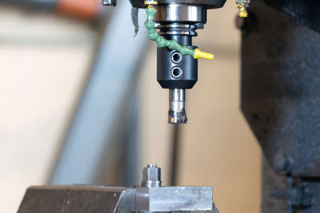 Spindle with a milling cutter in a mandrel on a CNC milling machine.の写真素材