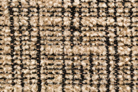 Texture of dark beige fabric close-up, fabric texture.