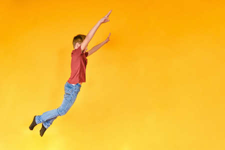 The boy with a joyful face bounced upの写真素材