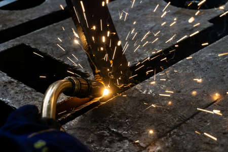 Welder at work in the workshop, electric and gas welding at work.