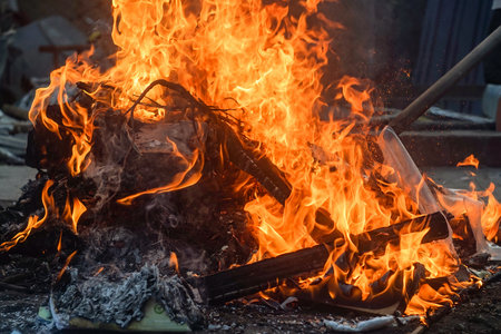 Bonfire with burning sticks and branches on fireの写真素材