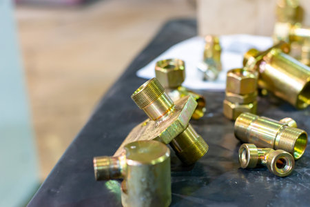 Brass and bronze grommets and threaded adapters are in bulk in the warehouse.の写真素材