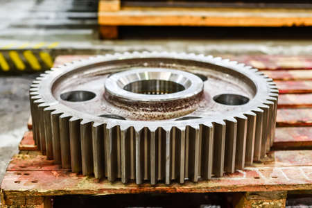 Cogwheel wheel on a wooden rack in a warehouse.の写真素材