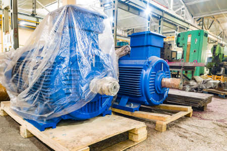 New large electric motors brought to the factory for installation.