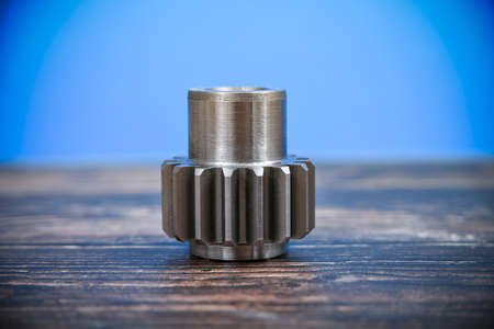 A cogwheel made on a gear cutting machine lies on the technical drawingsの写真素材