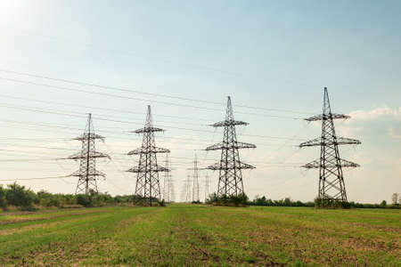 High voltage power line poles with wires.