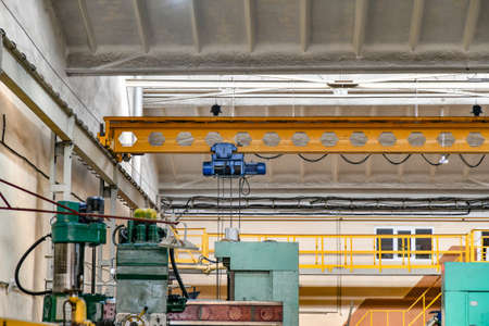 Overhead crane for lifting parts, assemblies and mechanisms at the factory.の写真素材