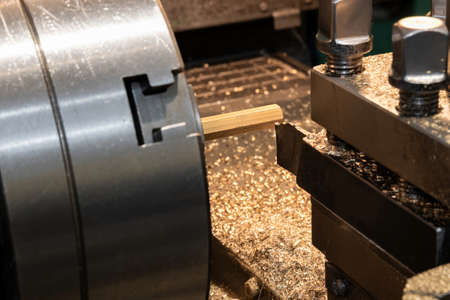 Making nuts from a bronze hexagon on a lathe.の写真素材