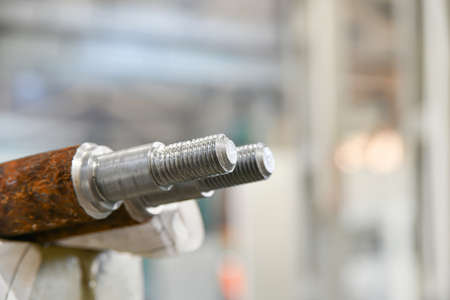 Threaded studs after production on a cnc lathe.の写真素材