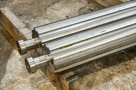The spline shaft after CNC milling lies in the warehouse on a rack.の写真素材
