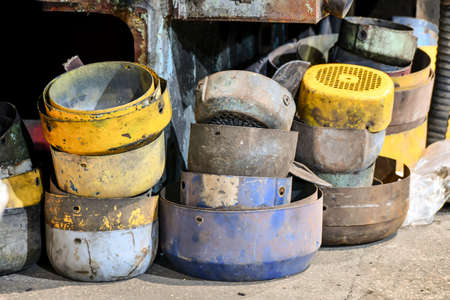 Old protective covers of disassembled electric motors in a warehouse in a workshop.の写真素材