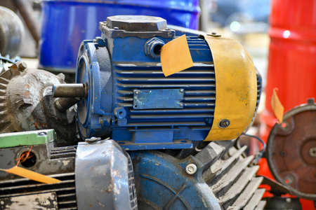 Warehouse for old broken and unused AC and AC motors in an electrical workshop.の写真素材