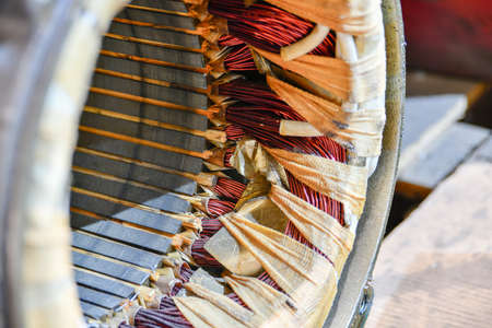 Repair and rewinding of the copper stator of the electric motor at the factory.