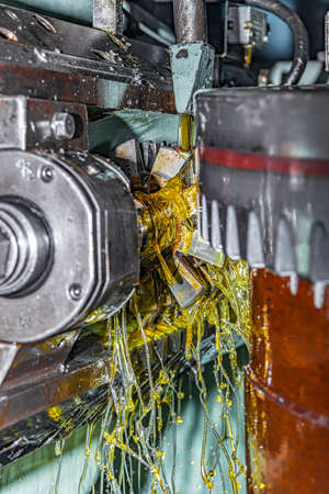 Making a gear and cutting a tooth with a worm cutter on a gear cutting machine.