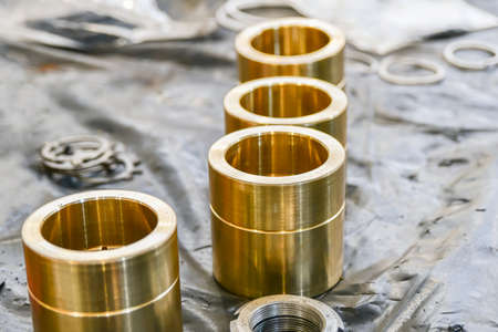 Bronze bushings for the manufacture of pistons for the repair and restoration of high pressure hydraulic pumps.の写真素材