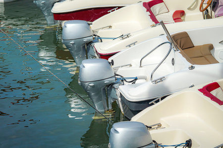 Expensive luxury yachts and boats in the port in the parking lot.の写真素材