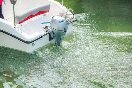 Pleasure boat with passengers on board goes sailing and traveling.