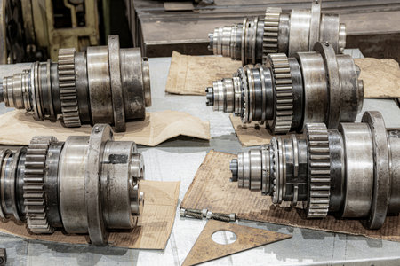 Disassembled spindles of cnc machines for repair in a metalworking equipment repair workshop.の写真素材