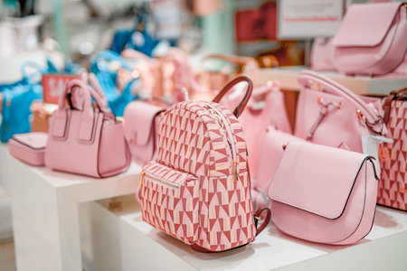 Pink leather women's fashion bags on sale in the new collection store.の写真素材