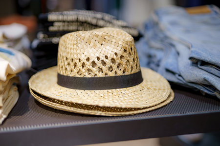 Summer men's straw hat for the beach and sun protection on sale in the store.の写真素材