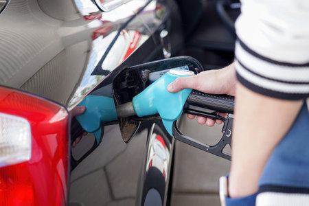 The driver fills his car with flammable fuel.の写真素材
