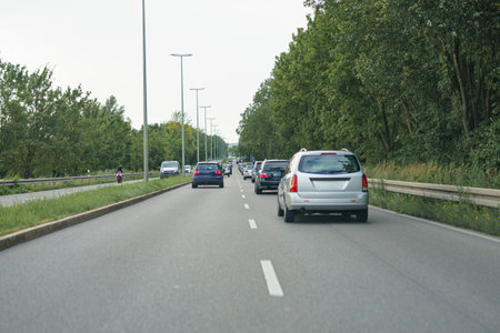 High-speed road with moving cars. Autobahn and cars.の写真素材