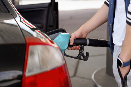 The driver fills his car with flammable fuel.の写真素材