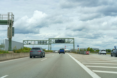 High-speed road with moving cars. Autobahn and cars.の写真素材
