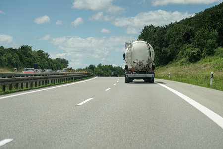 High-speed road with moving cars. Autobahn and cars.の写真素材