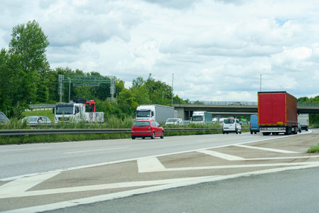 High-speed road with moving cars. Autobahn and cars.の写真素材