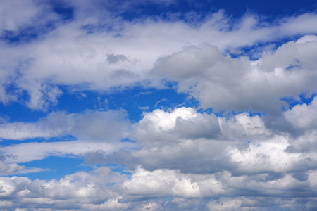 Blue sky with clouds of different shapes. Cloudy overcast sky.の写真素材