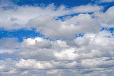 Blue sky with clouds of different shapes. Cloudy overcast sky.の写真素材