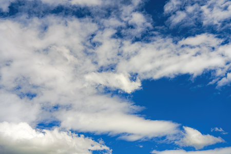 Blue sky with clouds of different shapes. Cloudy overcast sky.の写真素材